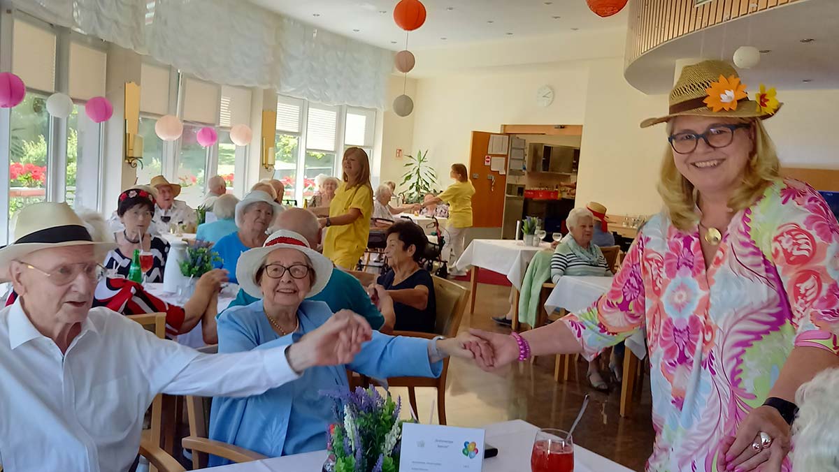 Care home manager Janin Tiedemann with residents